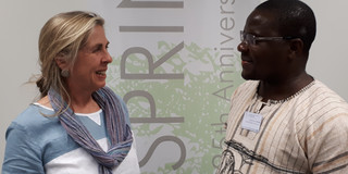 The picture shows Dr. Anne Weber and Gilbert Chilinde