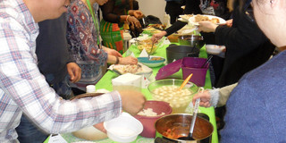 SPRING Party - Delicious Food Picture of students taking some of their food they made for each other.