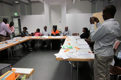Students sitting at tables in the workshop room