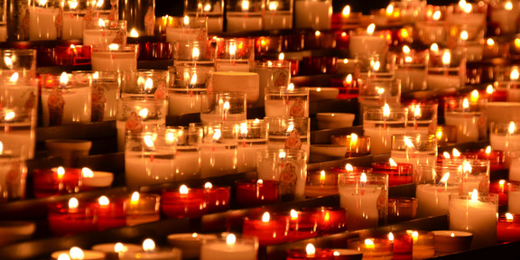 Many candles are lit together.