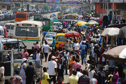 busy street with lots of people and cars