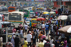 busy street with lots of people and cars
