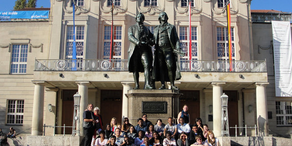 Picture of the SPRING batch in front of a statue of famous German poets.