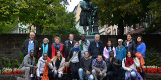 SPRING Students in front of a statue of a German poet Group picture in front of the statue of a German poet