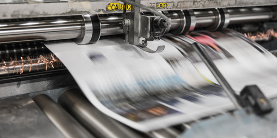 Printing press releases printed paper.