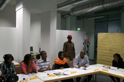 Picture of students sitting in the workshop room