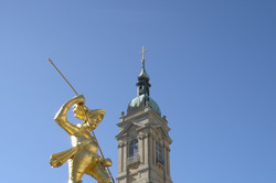 Statue in front of church Picture of a statue in front of a church.