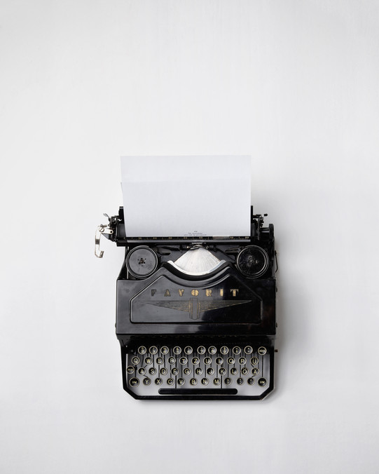 Typewriter A typewriter with a sheet of paper.