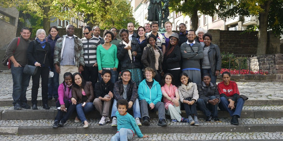 SPRING students in front of a statue Group picture of the SPRING students in front of a statue