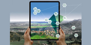 iPad vor Landschaft.
