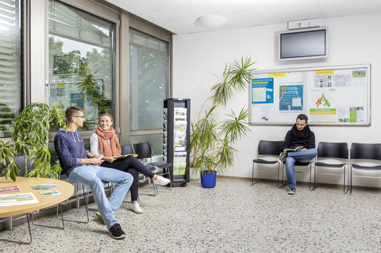 Students sitting in the waiting area of the Central Student Advisory Service