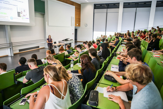 Students sit in a lecture at the beginning of the study.